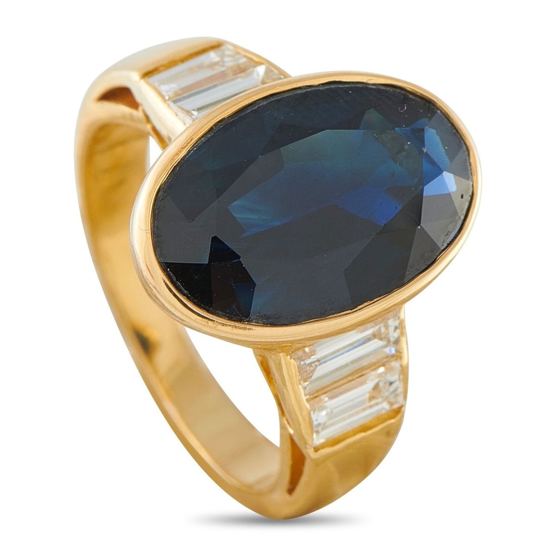 18K YELLOW GOLD 1.0CT DIAMOND AND SAPPHIRE RING: A sleek, sophisticated design makes this luxury ring simply unforgettable. At the center, a 7.0 carat Sapphire serves as a stunning focal point. Diamonds with a total weight of 1.0 carats flank the ce