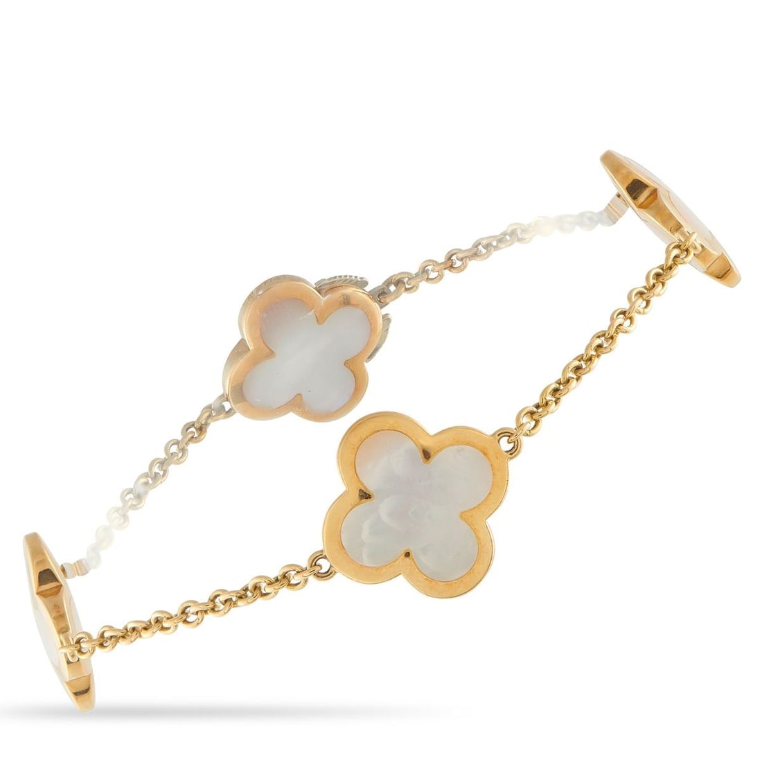 VAN CLEEF & ARPELS ALHAMBRA 18K YELLOW GOLD MOTHER OF PEARL BRACELET: This Van Cleef & Arpels Alhambra bracelet will never go out of style. Crafted from opulent 18K Yellow Gold, the iconic clover-shaped motifs accented by Mother of Pearl stones provide an obvious sense
