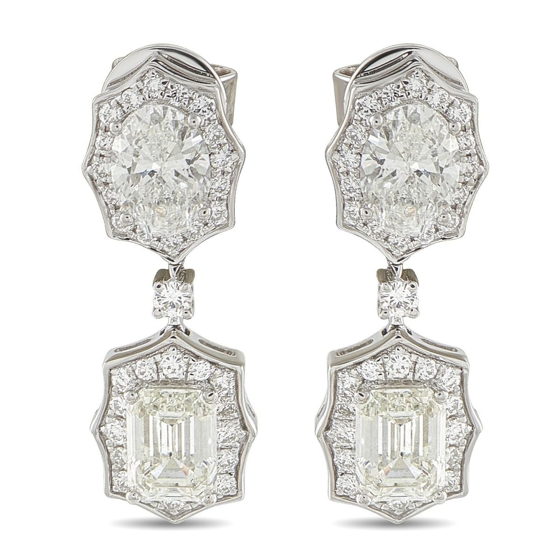 18K WHITE GOLD 3.91CT DIAMOND EARRINGS: These elegant earrings will continually impress. Sparkling central Diamonds totaling 3.25 carats instantly draw the eye, while additional Diamond accents totaling 0.66 carats make them even more exqui