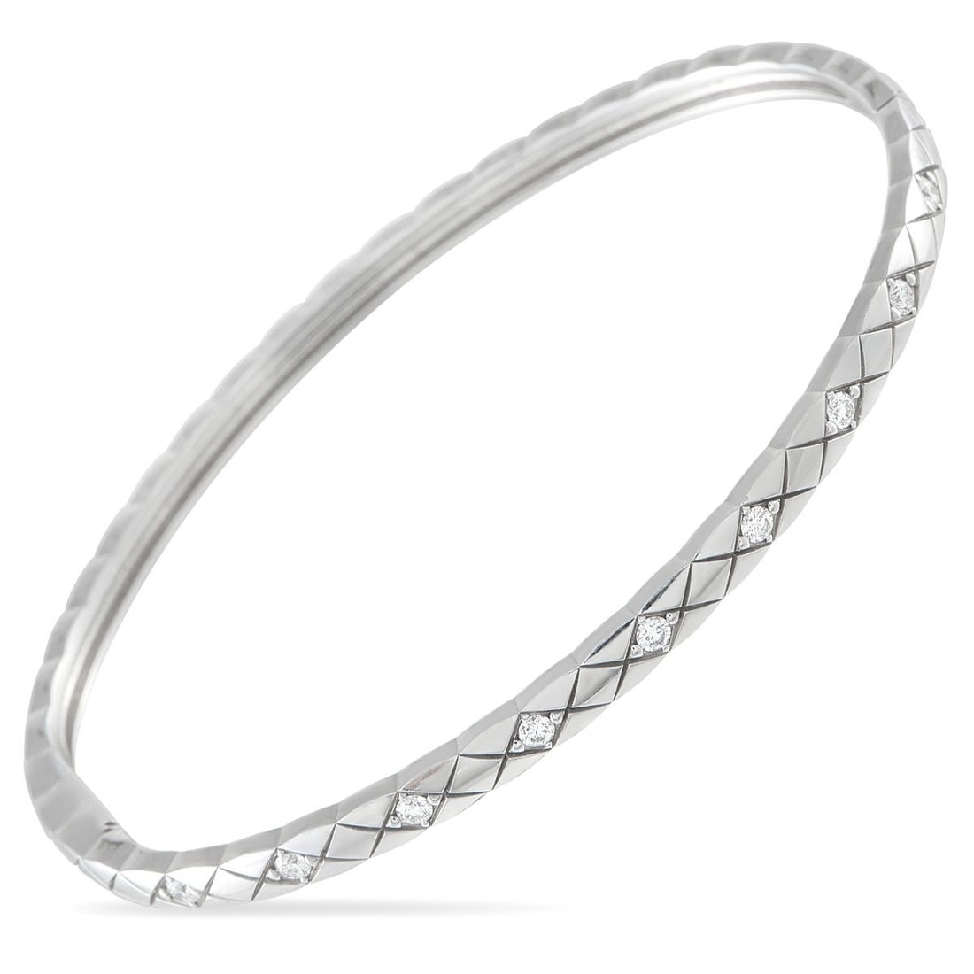 CHANEL 18K WHITE GOLD 0.36CT DIAMOND BANGLE BRACELET: This Chanel bangle bracelet will add polish to any ensemble. Diamonds with a total weight of 0.36 carats elevate the 18K White Gold setting, which comes to life thanks to a simple lattice pattern. It