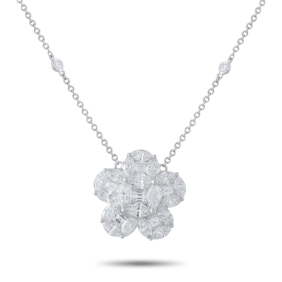 18K WHITE GOLD 4.75CT DIAMOND NECKLACE: A floral pendant covered in sparkling Diamonds totaling 4.75 carats makes this charming necklace a luxurious addition to any ensemble. Crafted from 18K White Gold, the pendant measures 0.75 round and 