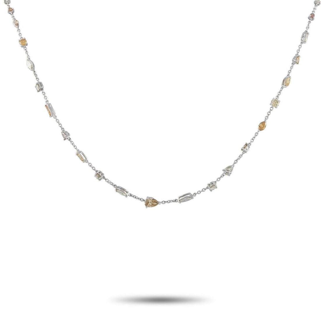 14K WHITE GOLD 5.50CT MULTICOLORED DIAMOND NECKLACE: A series of sparkling Diamonds in a variety of colors and cuts makes this necklace an elegant addition to any ensemble. Set in 14K White Gold, together they possess a total weight of 5.50 carats. This
