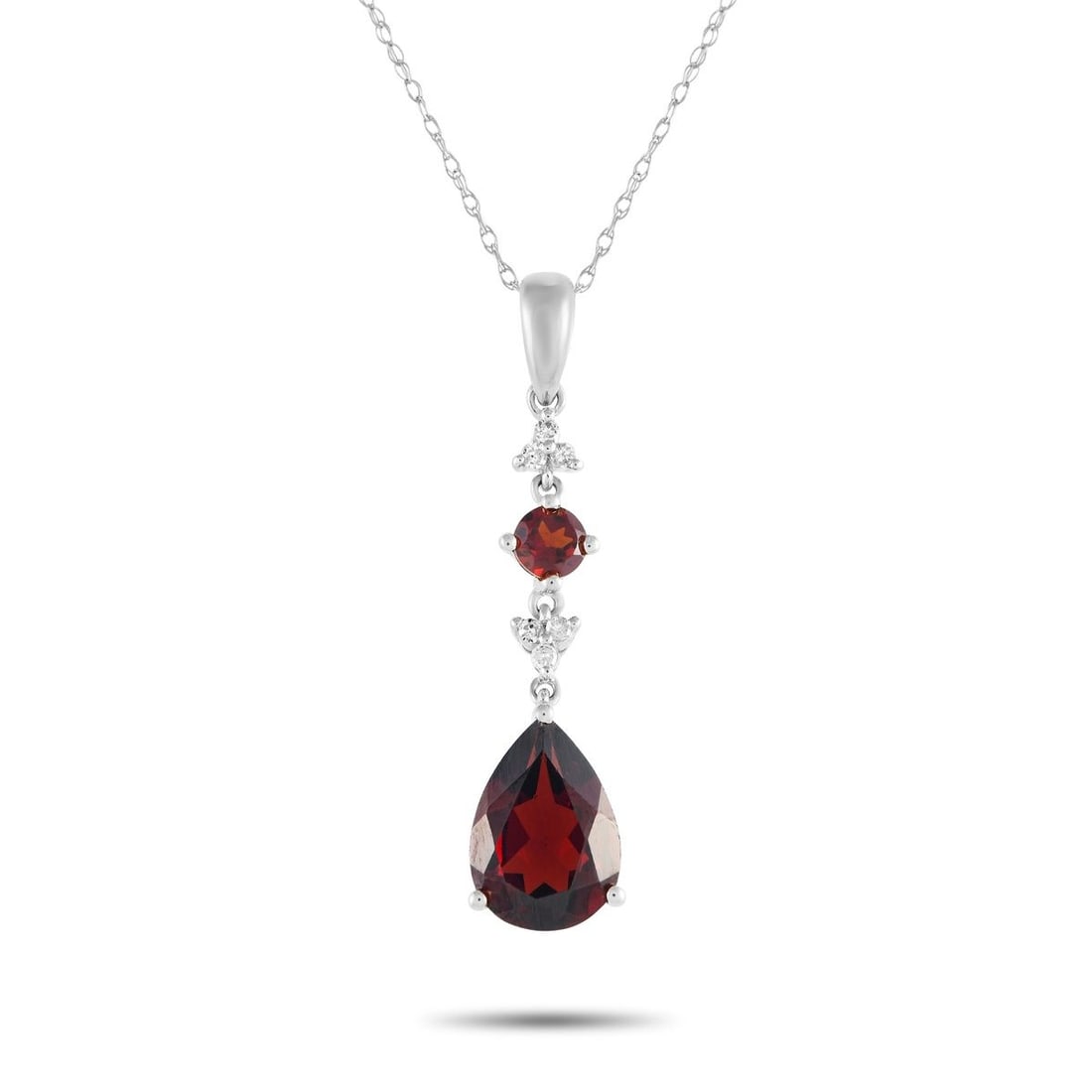 14K WHITE GOLD 0.05CT DIAMOND AND GARNET PENDANT NECKLACE: Add a stylish pop of color to any ensemble with this impeccably crafted necklace. Ideal for any occasion, this sophisticated accessory features a 14K white gold pendant measuring 1.25 long by 0.25 wid