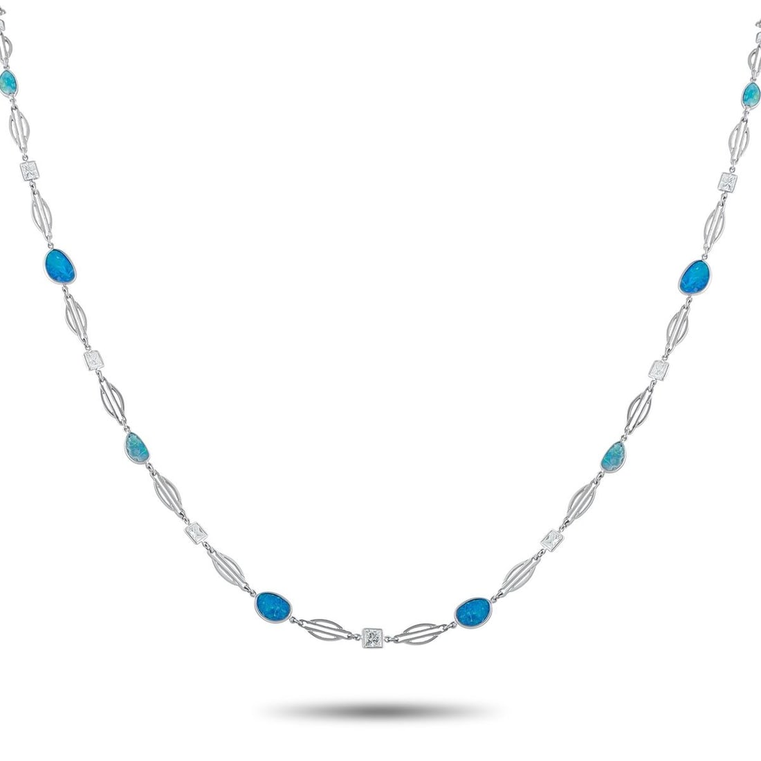 PLATINUM 7.40CT DIAMOND AND OPAL NECKLACE: Add an elegant pop of color to any ensemble with this stunning necklace. The delicate design comes to life thanks to square-cut Diamonds totaling 7.40 carats and shimmering Opal gemstones with a blue 