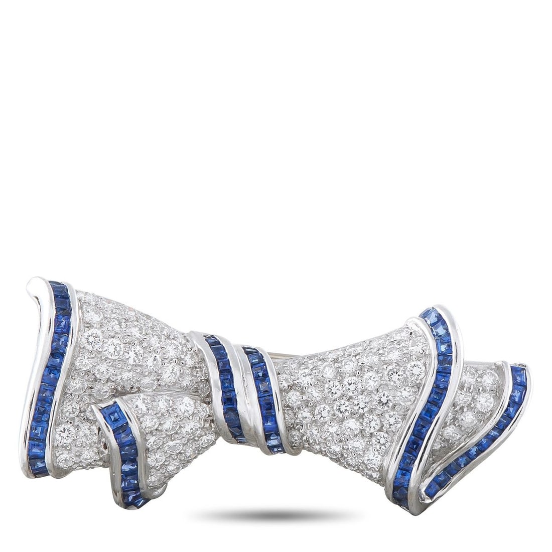 VINTAGE PLATINUM AND 18K YELLOW GOLD 2.40CT DIAMOND AND SAPPHIRE BOW BROOCH: This exquisite bow brooch will put the perfect finishing touch on any ensemble. The charming design is elevated by diamonds with a total weight of 2.40 carats and sapphire accents totaling 1.50 carats