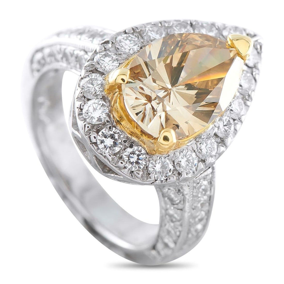 14K WHITE GOLD 4.08CT DIAMOND RING: A 3.08 carat pear-shaped Diamond center stone with a golden-brown hue allows this luxury ring to come alive with color. Stylish and statement-making, additional Diamonds with a total weight of 1.0 car