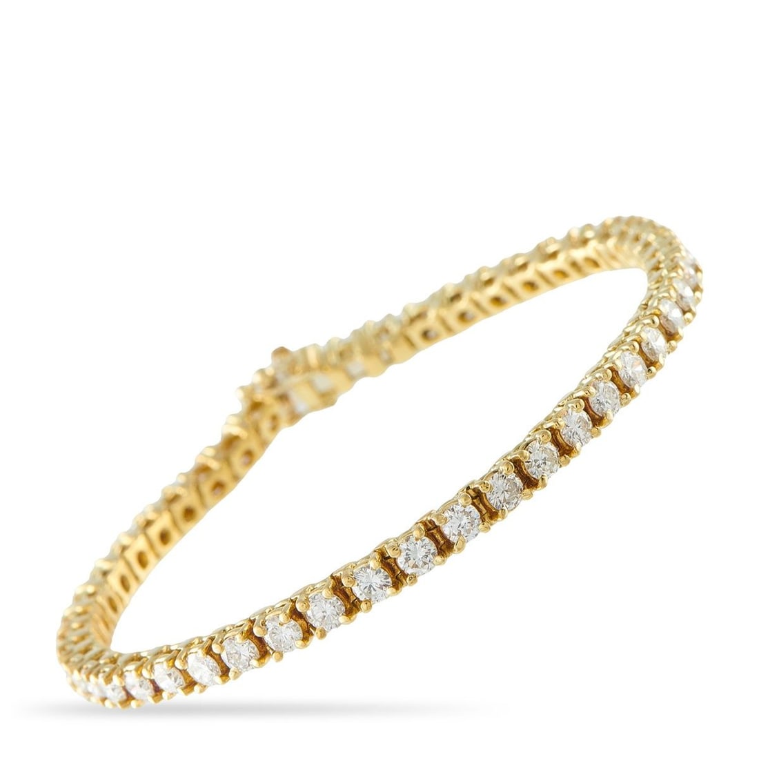 18K YELLOW GOLD 6.90CT DIAMOND TENNIS BRACELET: This tennis bracelet exudes timeless elegance. Simple and sophisticated, dazzling Diamonds totaling 6.90 carats allow it to effortlessly catch the light. Set in 18K Yellow Gold, it measures 6.75 long.