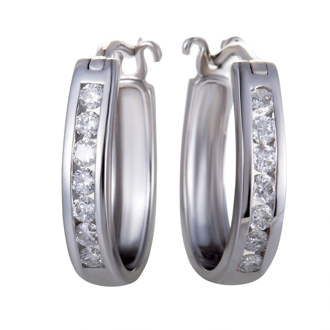 14K WHITE GOLD OVAL CHANNEL SET DIAMOND HOOP HUGGIES EARRINGS .33 CARAT (0.33 CTW) DIAMONDS: The elegantly gleaming 14K white gold and the luxuriously glistening diamond stones complement each other wonderfully in these gorgeous hoop earrings that offer a delightfully classy appearance. The p