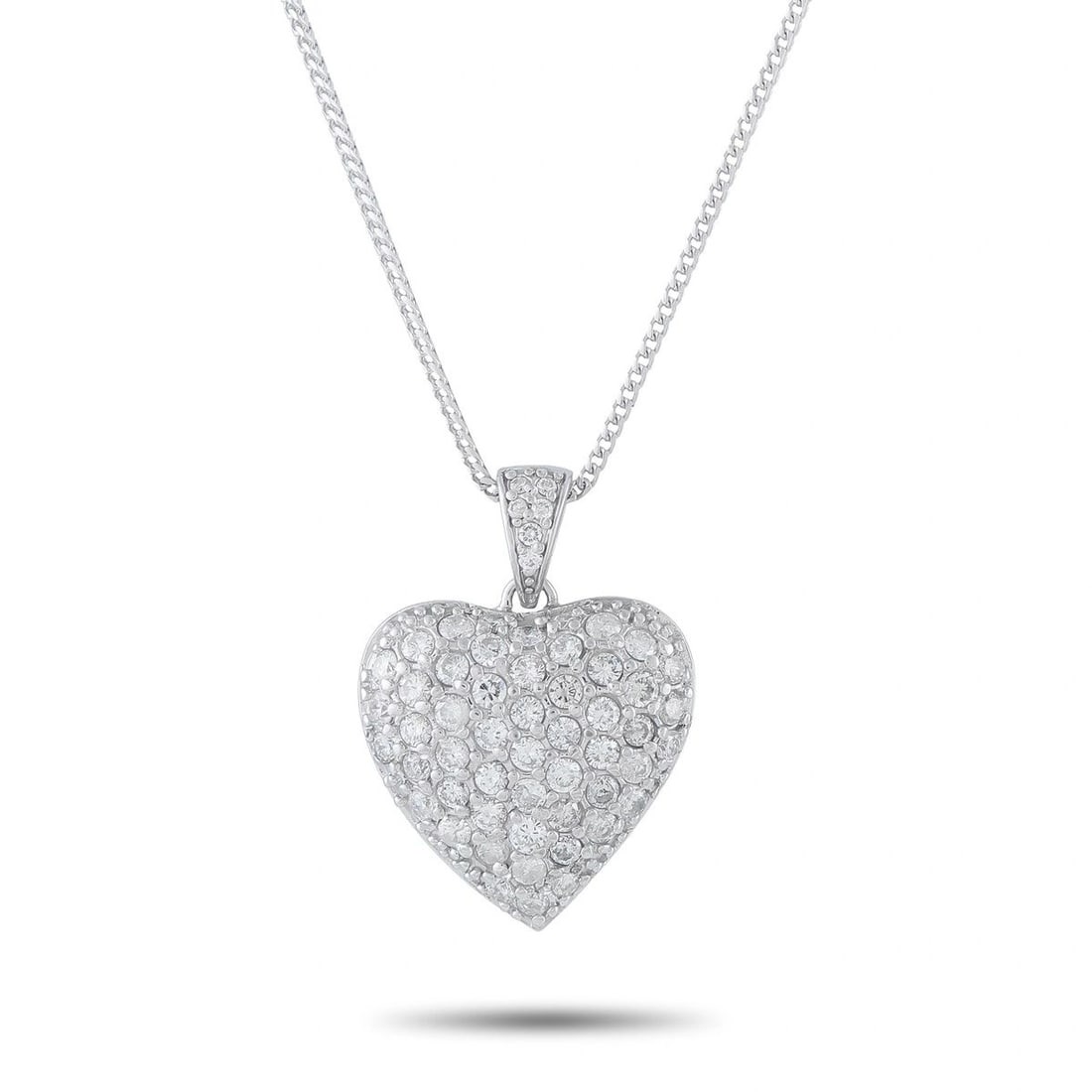 14K WHITE GOLD 2.70CT DIAMOND PAVE HEART PENDANT NECKLACE: A romantic and brilliantly sparkling pendant necklace in 14K white gold, centering a domed heart-shaped pendant pav-set with round brilliant diamonds totaling 2.70 ct. The pendant hangs from a fine cu