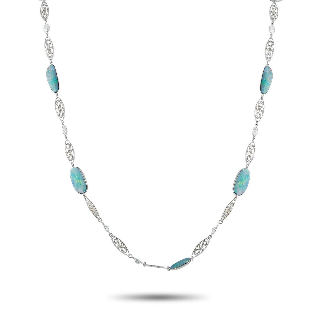 PLATINUM 5.50CT DIAMOND AND OPAL NECKLACE: This luxury necklace is filled with dynamic details. Intricate metalwork and sparkling Diamond accents totaling 5.50 carats elevate the overall design. Fiery blue Opal gemstones make it a unique acces