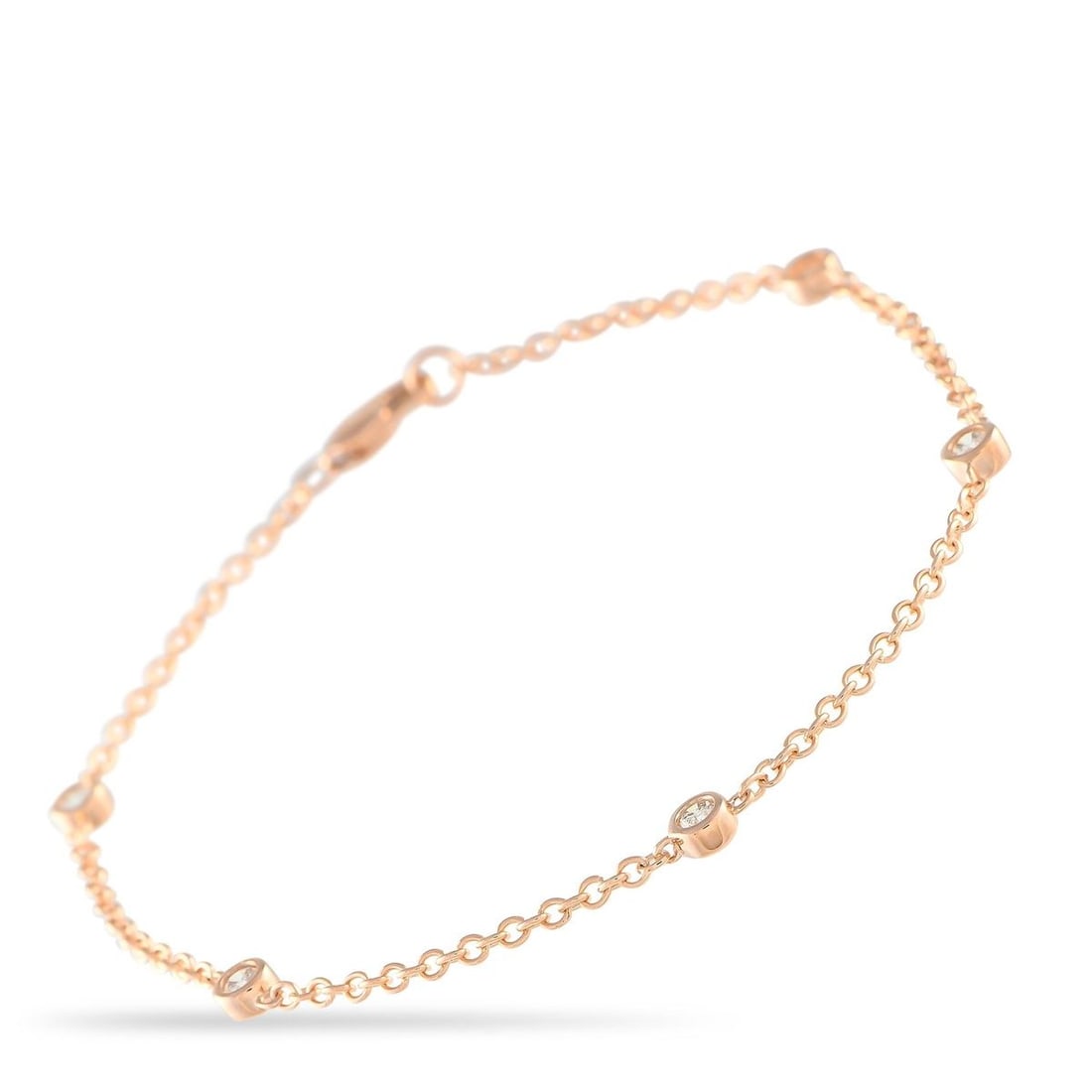 14K ROSE GOLD 0.18CT DIAMOND BRACELET: Bezel-set Diamonds with a total weight of 0.18 carats add a touch of luxury to this elegant, understated bracelet. Crafted from 14K Rose Gold, this piece measures 7.0 long and is an ideal piece for