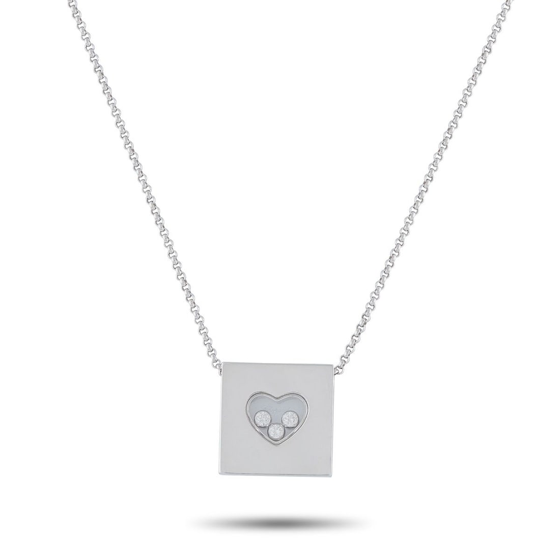 CHOPARD HAPPY DIAMONDS 18K WHITE GOLD 0.17CT DIAMOND NECKLACE: This Chopard Happy Diamonds necklace offers enduring elegance. The pendant includes a transparent heart-shaped center that contains a trio of floating Diamonds totaling 0.17 carats. Crafted from 18K W