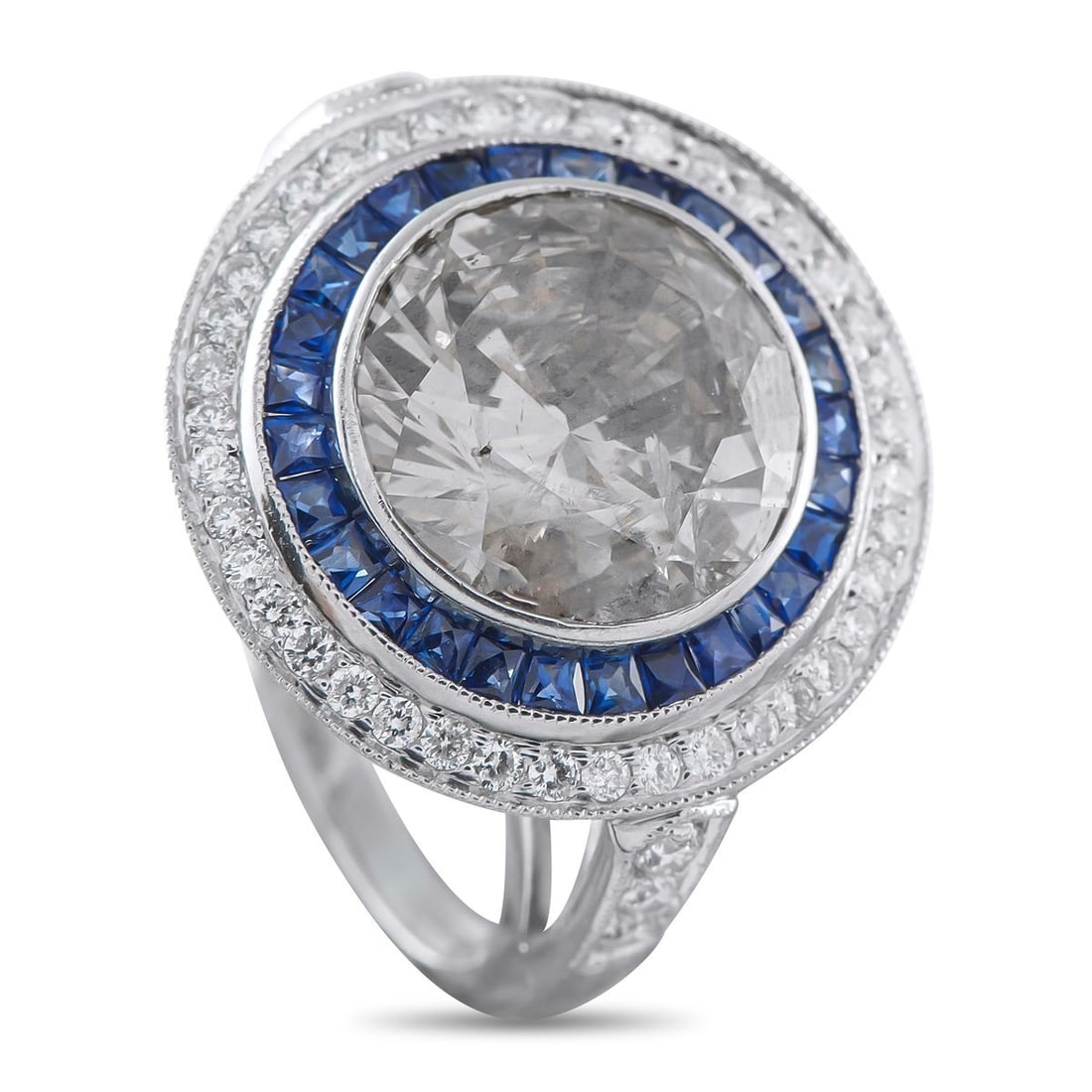 PLATINUM 6.17CT DIAMOND AND SAPPHIRE RING: A stunning combination of colors and textures makes this ring unlike anything youve seen before. At the center, a brown 5.82 carat Diamond with I1 clarity offers contemporary sophistication. Its surro