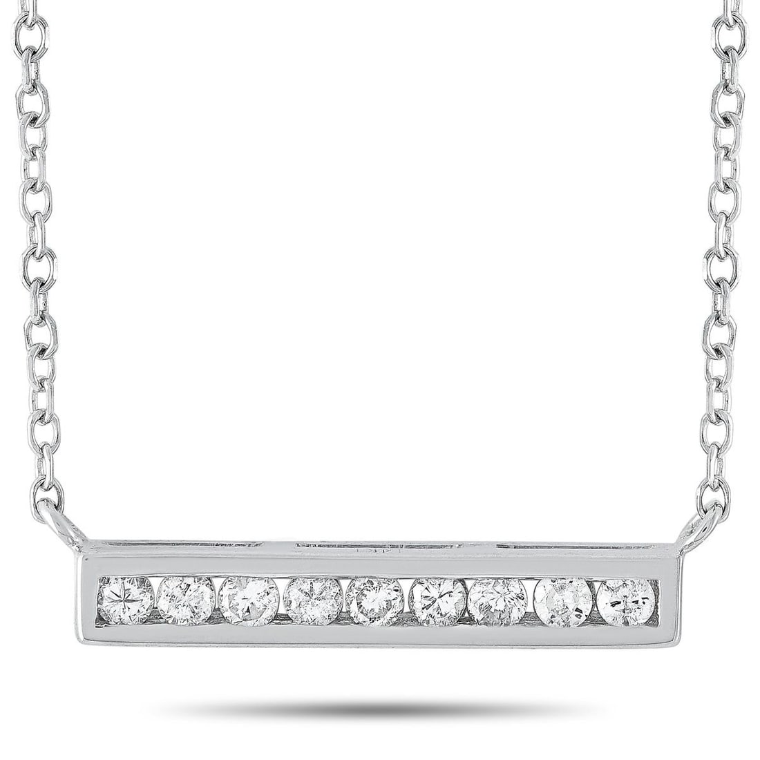 14K WHITE GOLD 0.10 CT DIAMOND PENDANT NECKLACE: This necklace is made of 14K white gold and embellished with diamonds that amount to 0.10 carats. The necklace weighs 1.5 grams and boasts a 15 chain and a pendant that measures 0.80 in length and 0.6
