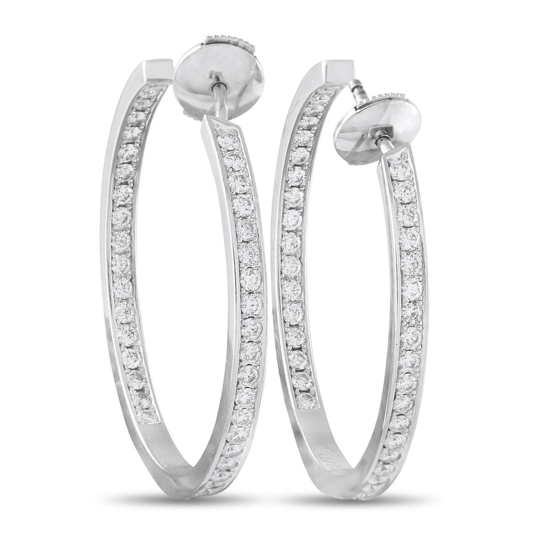 CARTIER 18K WHITE GOLD 1.50CT DIAMOND HOOP EARRINGS: These Cartier hoop earrings are simply elegant. The sleek 18K White Gold settings provide them with a minimalist aesthetic, while sparkling Diamonds totaling 1.50 carats catch the light from every ang