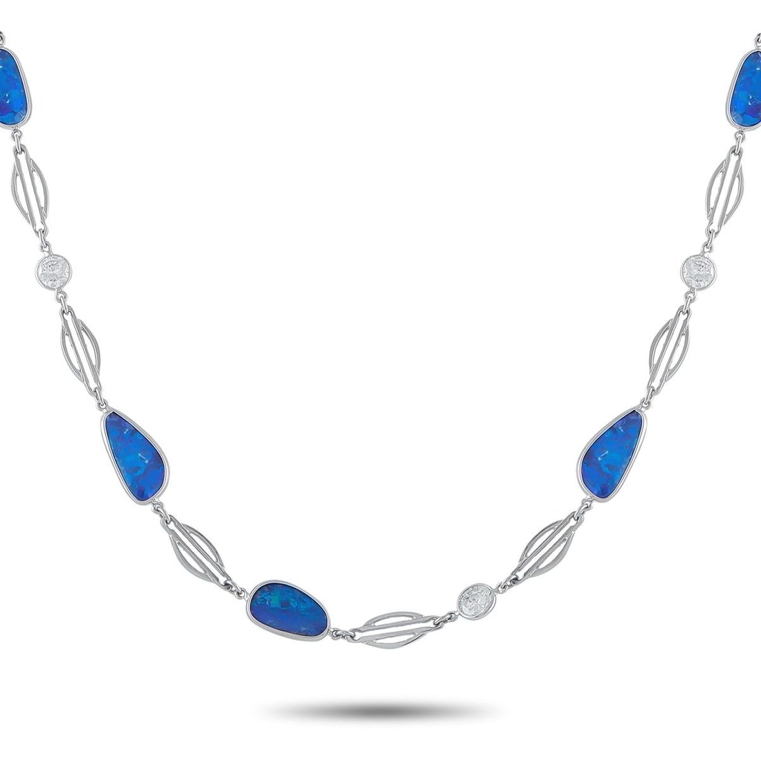 PLATINUM 4.60CT DIAMOND AND OPAL NECKLACE: This luxury necklace is instantly captivating. Breathtaking blue Opals add a stylish pop of color to the contemporary design. Diamonds with a total weight of 4.60 carats make it an impressive piece th