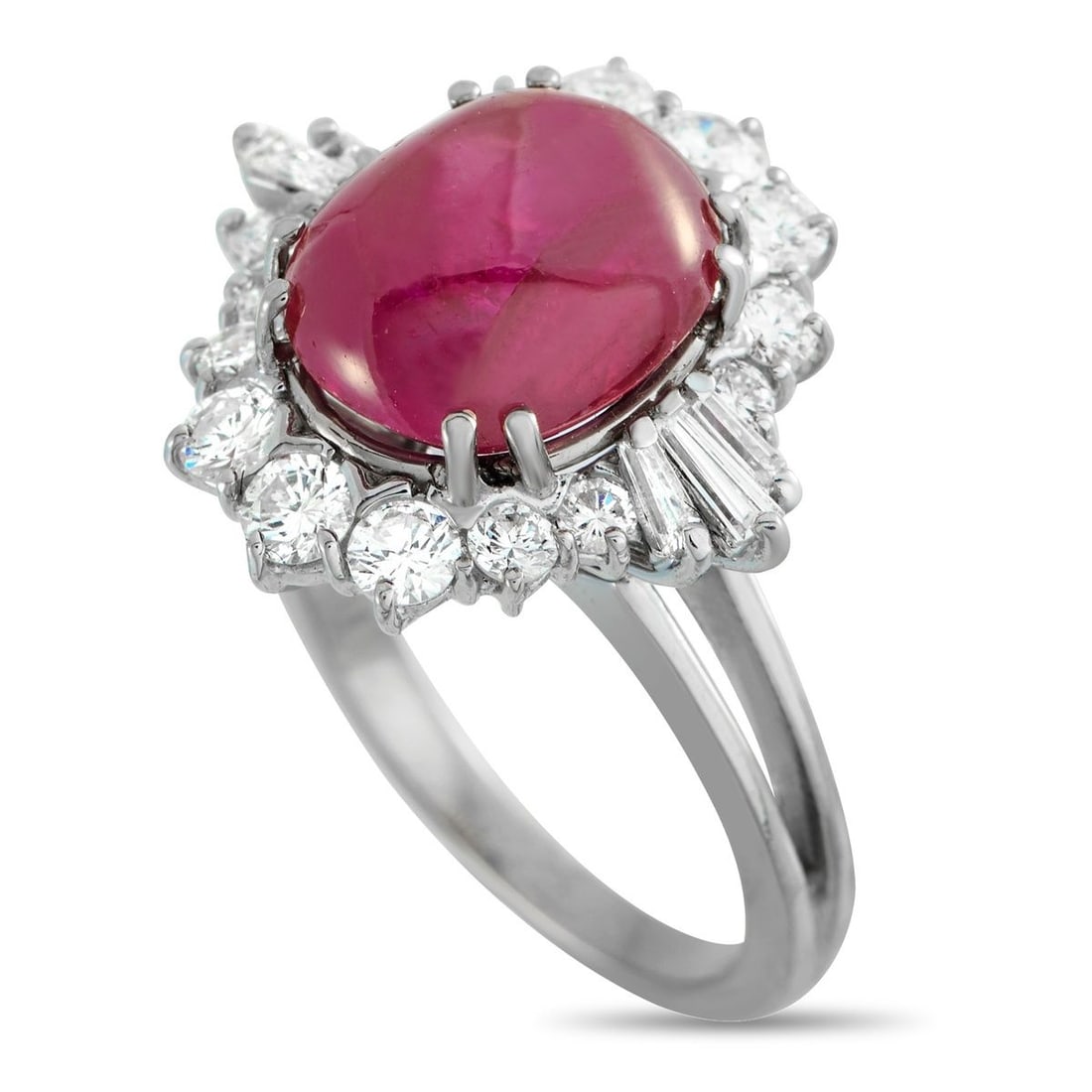 18K WHITE GOLD 1.0CT DIAMOND AND RUBY RING: Consciously aligned with the 1920s design language, this ring presents a look that's luminous and composed. A 6 ct oval ruby takes the spotlight, held by four double prongs that give it a structured f