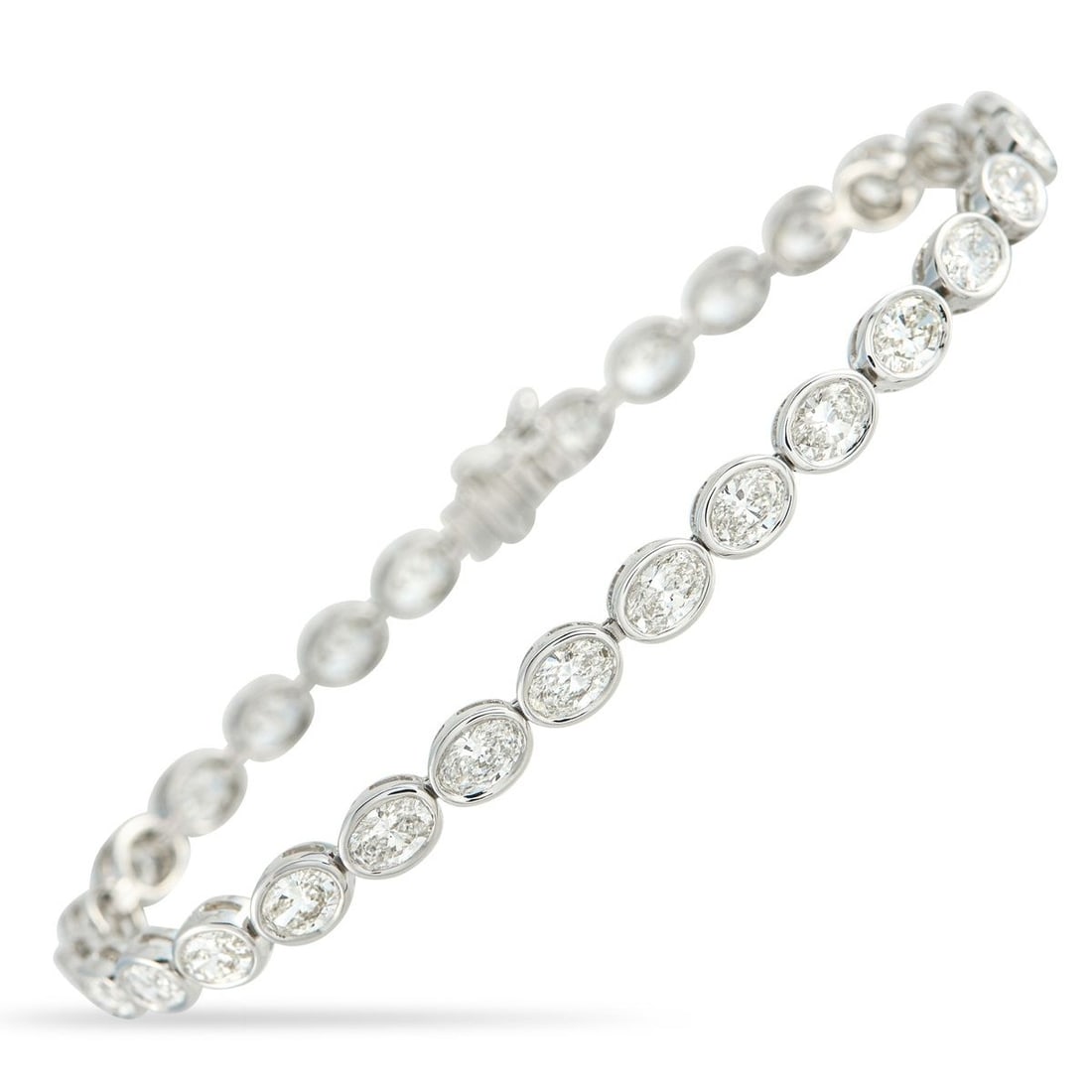 18K WHITE GOLD 7.25CT DIAMOND BRACELET: A series of sparkling Diamonds with a total weight of 7.25 carats makes this bracelet simply unforgettable. Simple, elegant, and perfectly understated, its crafted from 18K White Gold and measures 7.0