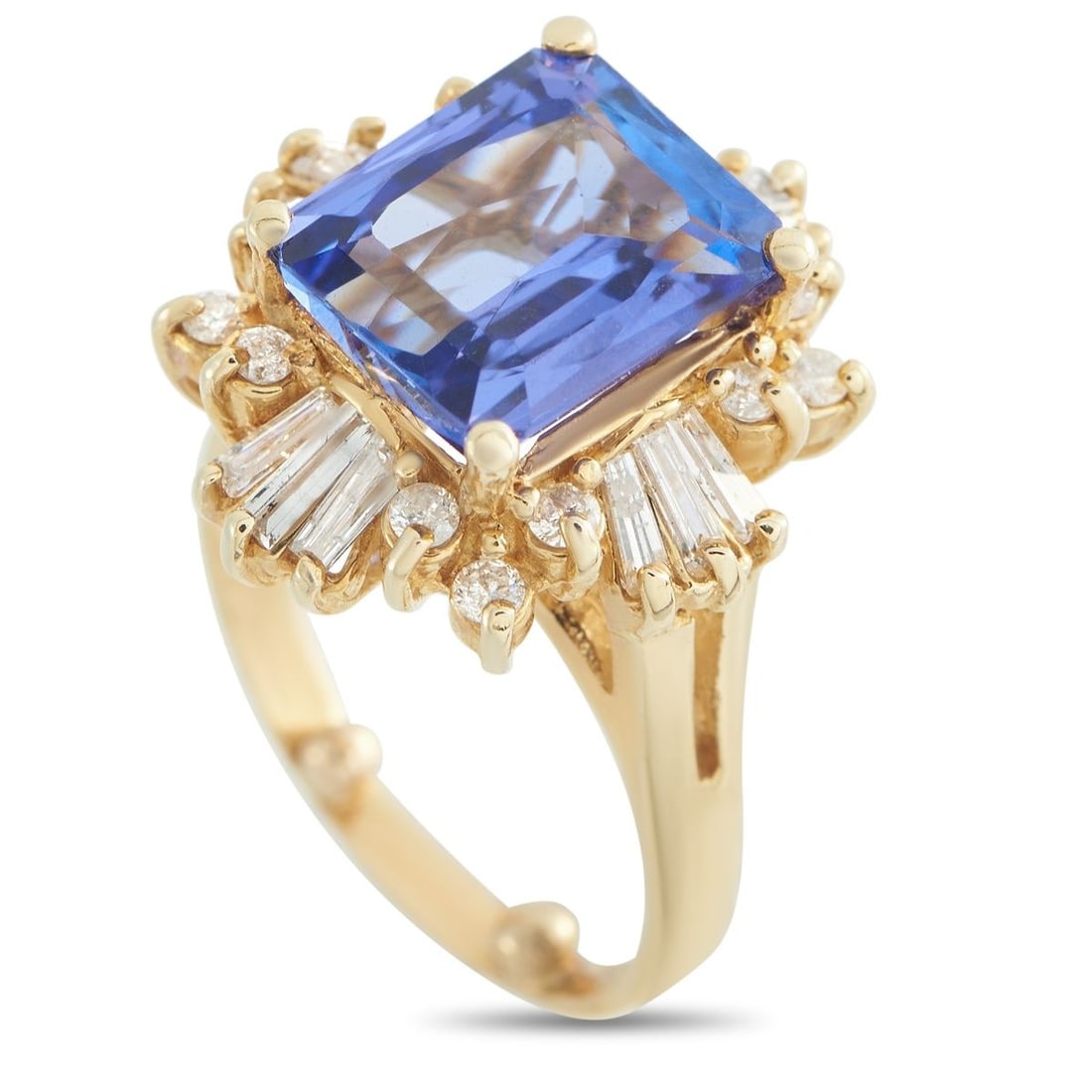 14K YELLOW GOLD 1.20CT DIAMOND AND TANZANITE RING: A 9.0 carat Tanzanite gemstone makes a statement at the center of this luxury ring. The ornate 14K Yellow Gold setting is further elevated by sparkling Diamonds with a total weight of 1.20 carats. Wit
