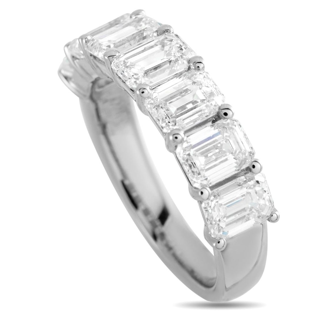 18K WHITE GOLD 3.60CT DIAMOND RING: A series of emerald cut Diamonds totaling 3.60 carats make a statement at the top of this simple, elegant ring. Ideal for everyday wear, the 18K white gold setting features a 3mm wide band and a 3mm t