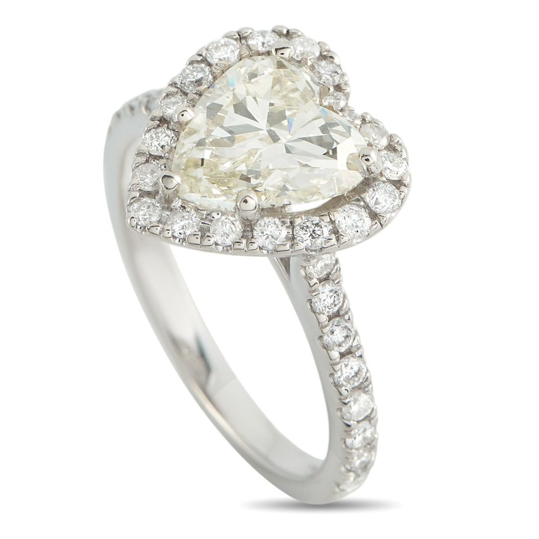 14K WHITE GOLD 2.31CT DIAMOND HEART RING: A heart-cut diamond remains one of the most distinct symbols used in engagement jewelry. Here, a 1.98-carat heart-shaped diamond graded M -VS2 sits in a five-prong setting. A halo of round diamonds tr