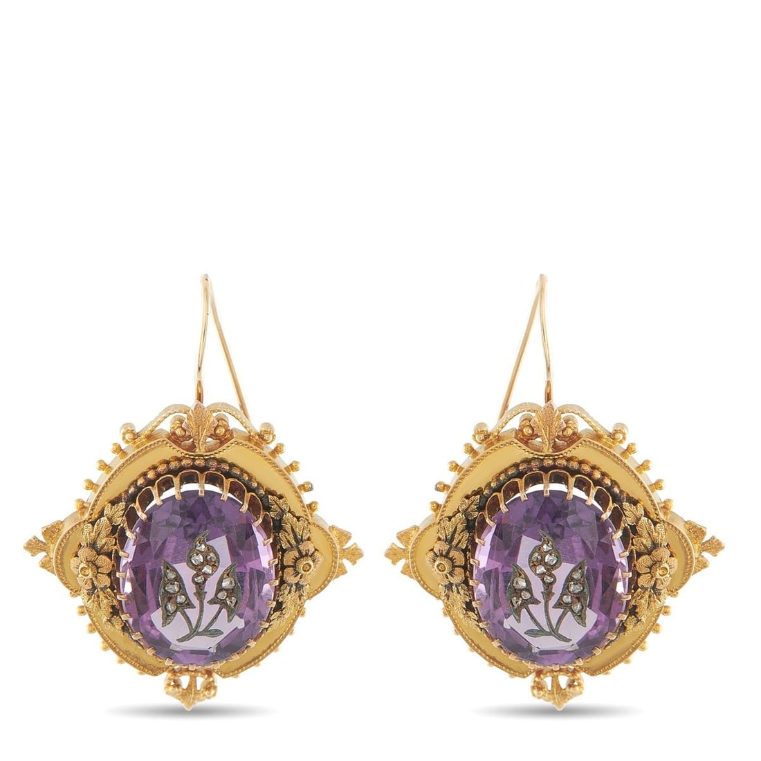 ANTIQUE 14K YELLOW GOLD AMETHYST EARRINGS: These antique earrings are full of exquisite details. Intricate floral motifs and ornate metalwork elevate the 14K Yellow Gold settings. Amethyst gemstones at the center impart a stylish pop of color.