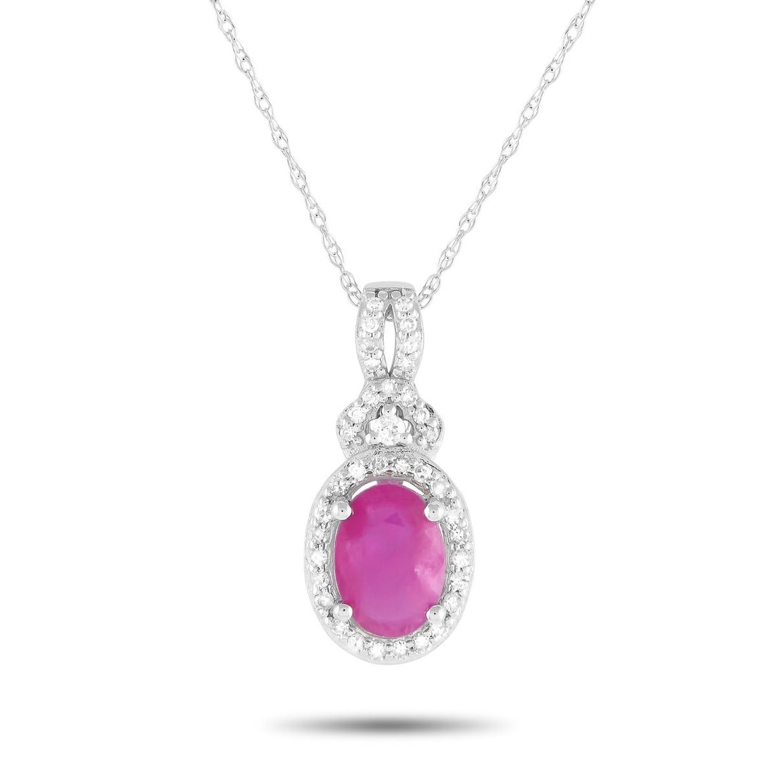 14K WHITE GOLD 0.15CT DIAMOND AND RUBY PENDANT NECKLACE: An intricate 14K White Gold pendant measuring 0.75 long and 0.35 wide serves as a stunning focal point on this simple, elegant necklace. The pendants charming Ruby center stone comes to life thanks to