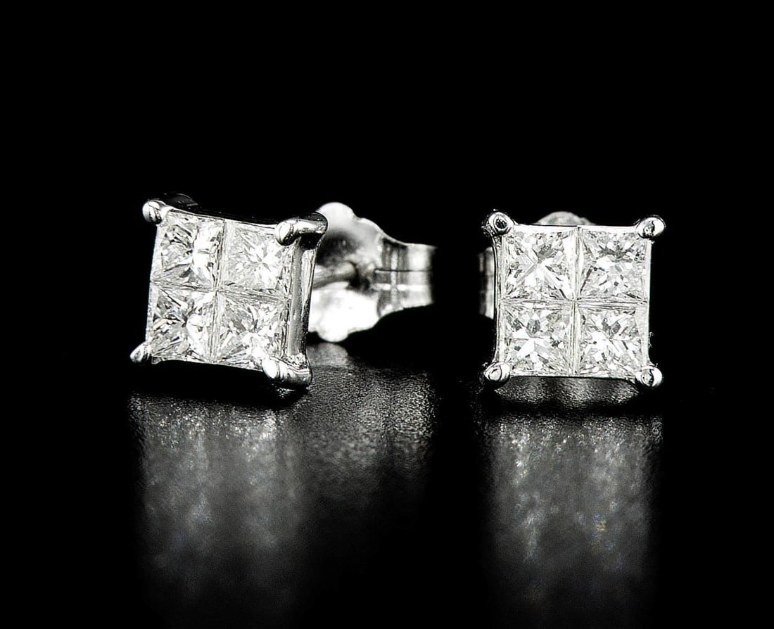 18kt White Gold 0.8ctw Diamond Earrings: One pair of 18k white gold earrings (18k stamped), each set with natural diamonds. Jewelry Weight: 1.2Grs Total Diamonds Weight: 0.8Cts Main Stones Description: Quantity: 8 Cut and shape: Princess Car