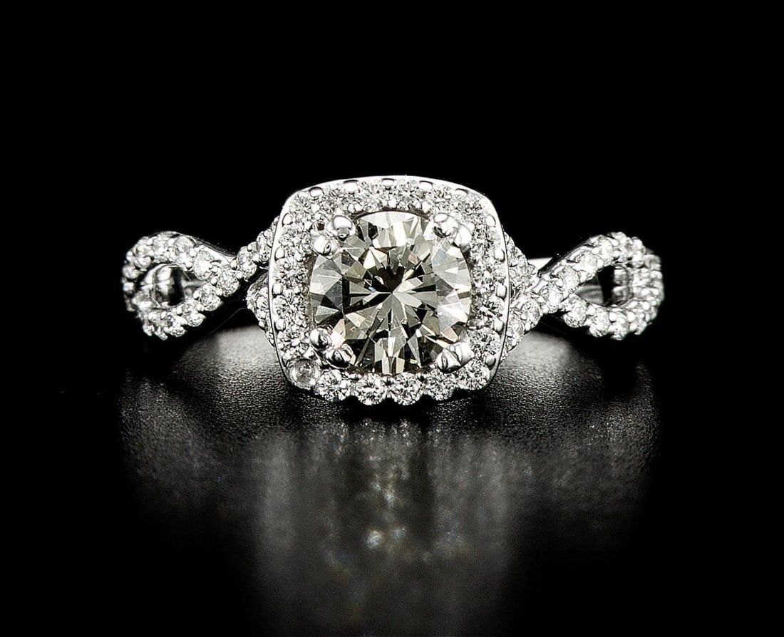 14kt White Gold 1.7ctw Diamond Ring: One 14k white gold ring (14k stamped), set with one center natural diamond and small natural diamonds around and on the sides. Jewelry Weight: 4.79Grs Total Diamonds Weight: 1.7Cts Main Stones Descrip