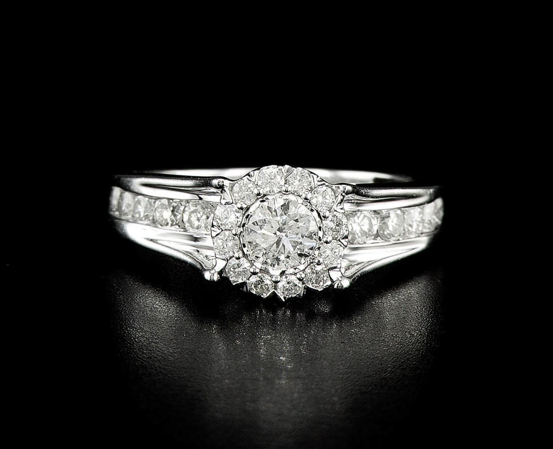 14kt White Gold 1.04ctw Diamond Ring: One 14k white gold ring (14k stamped), set with one center natural diamond and small natural diamonds around and on the sides. Jewelry Weight: 4.96Grs Total Diamonds Weight: 1.04Cts Main Stones Descri
