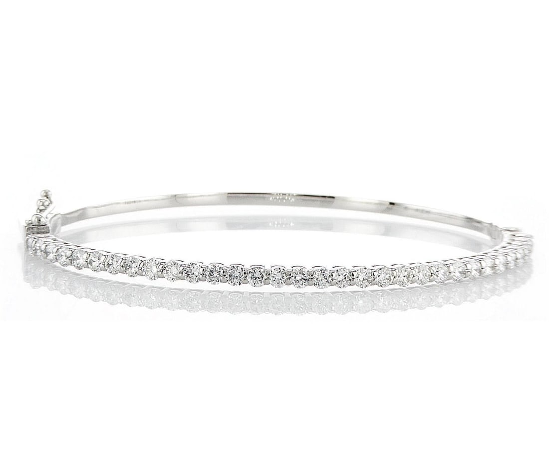 14kt White Gold 1.9ctw Diamond Bracelet: One 14k white gold bracelet, set with lab grown diamonds. Jewelry Weight: 9.13Grs Total Diamonds Weight: 1.9Cts Main Stones Description: Quantity: 32 Cut and shape: Round Brilliant Carats Weight: 1.9 