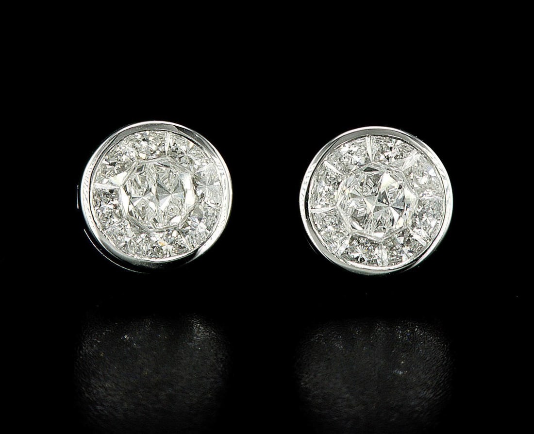 18kt White Gold 1.3ctw Diamond Earrings: One pair of 18k white gold earrings (18k stamped), each set with natural diamonds. Jewelry Weight: 3.94Grs Total Diamonds Weight: 1.3Cts Main Stones Description: Cut and shape: Mixed Shapes Carats Wei