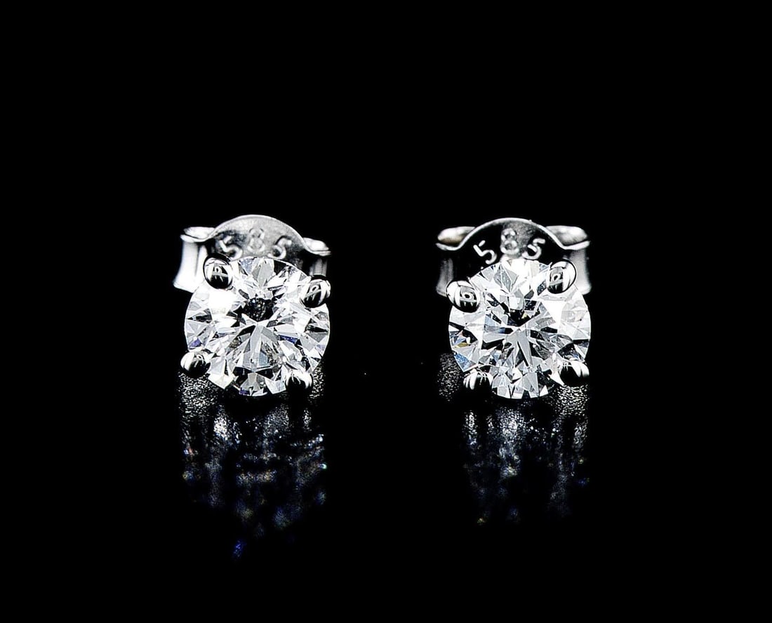14kt White Gold 1.15ctw Diamond Earrings: One pair of 14k white gold earrings (14k stamped), each set with lab grown. Jewelry Weight: 1.09Grs Total Diamonds Weight: 1.15Cts Main Stones Description: Quantity: 2 Cut and shape: Round Brilliant C