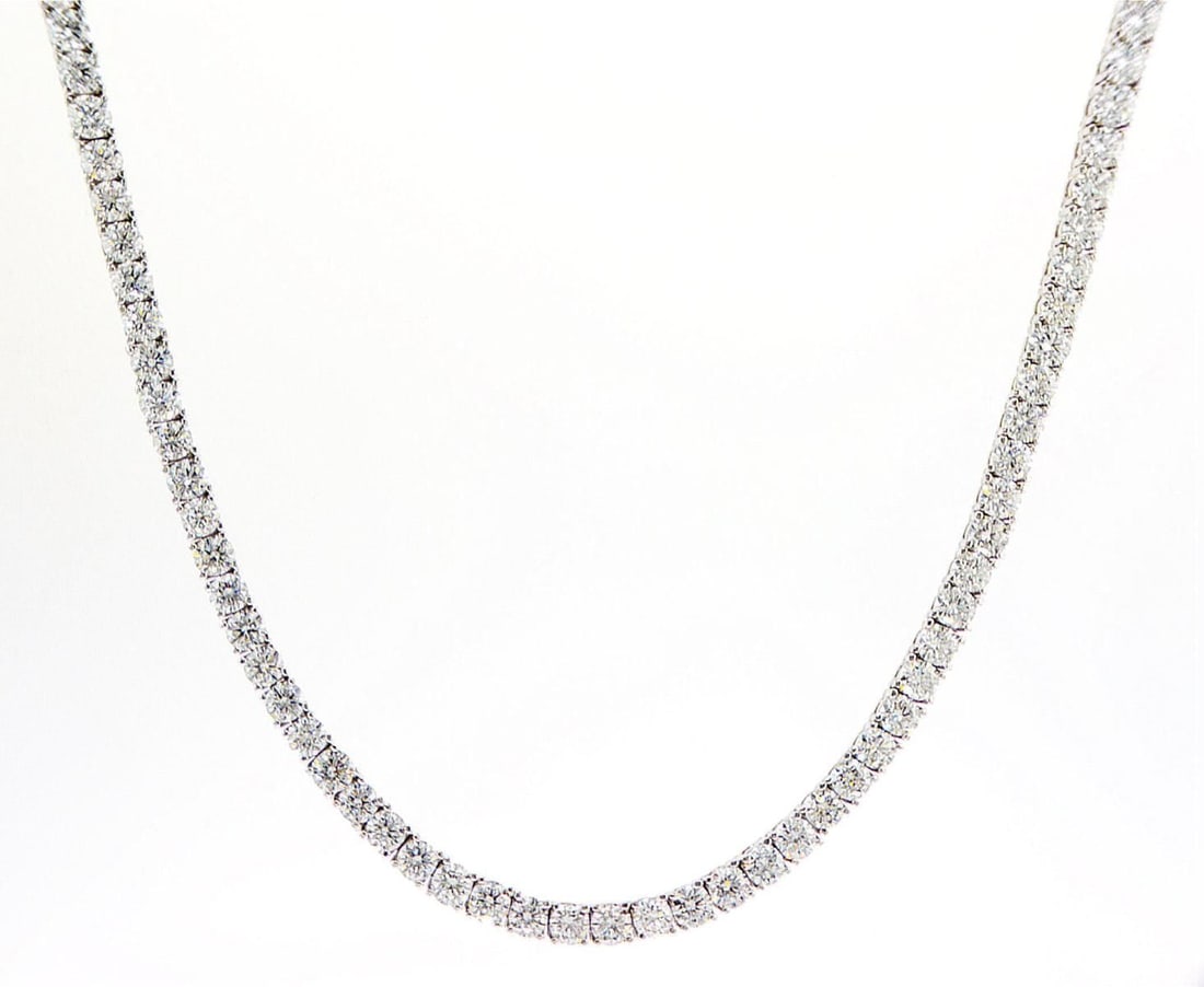 14kt White Gold 16.89ctw Diamond Necklace: Jewelry Description Jewelry Weight: 27.62 Grs Total Diamonds Weight: 16.89 Cts Precious Metal: 14kt White Gold Certificate Number: 4440187735 Appraised Value: 9500