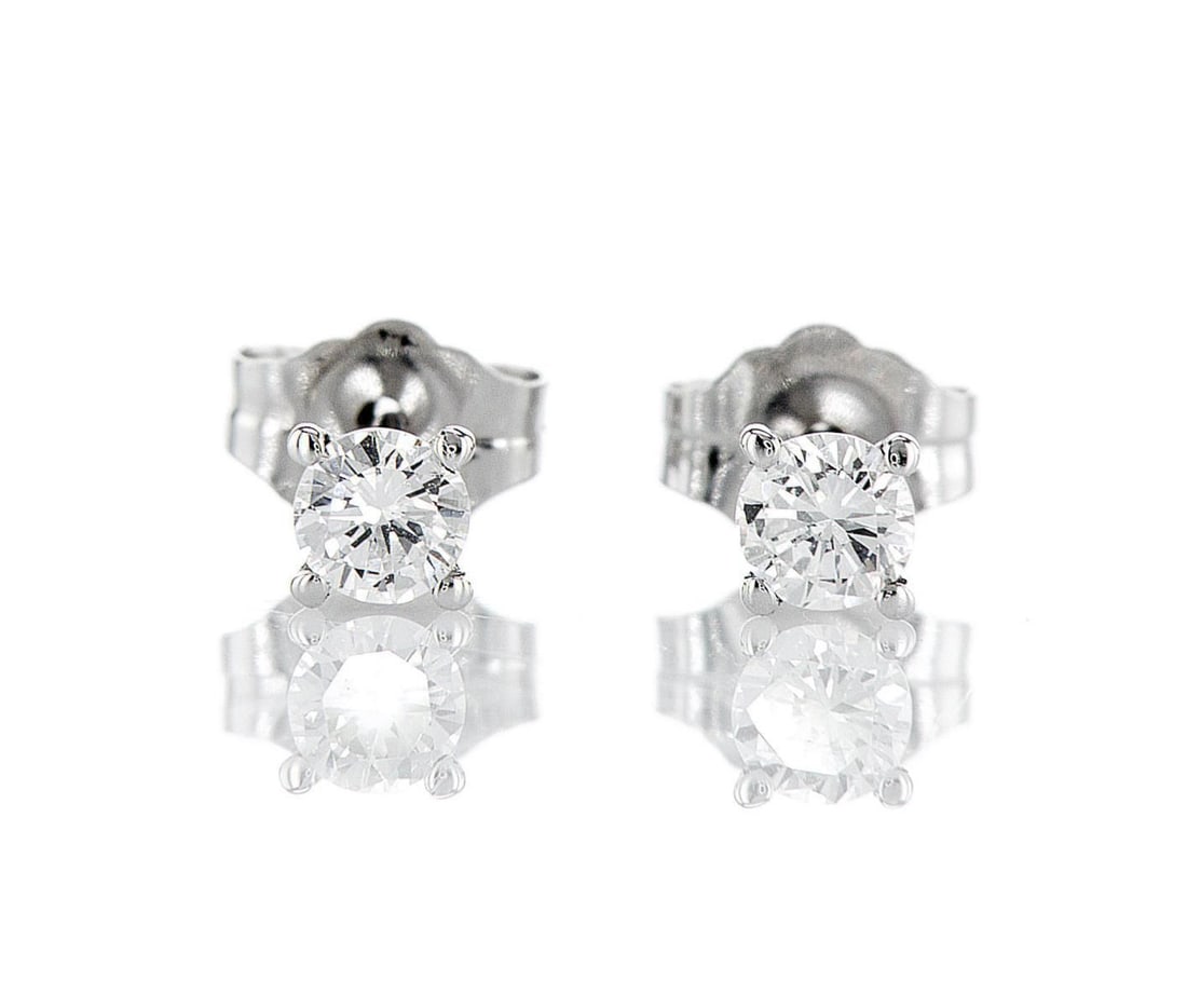 14kt White Gold 0.3ctw Diamond Earrings: One pair of 14k white gold earrings (14k stamped), each set with one lab grown diamond Jewelry Weight: 0.6Grs Total Diamonds Weight: 0.3Cts Main Stones Description: Quantity: 2 Cut and shape: Round Br