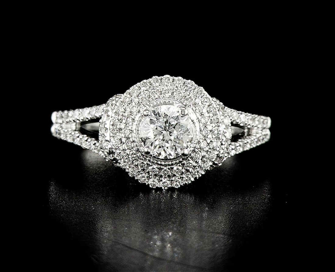 14kt White Gold 0.95ctw Diamond Ring: One 14k white gold ring (14k stamped), set with one center natural diamond and small natural diamonds around and on the sides. Jewelry Weight: 4.65Grs Total Diamonds Weight: 0.95Cts Main Stones Descri