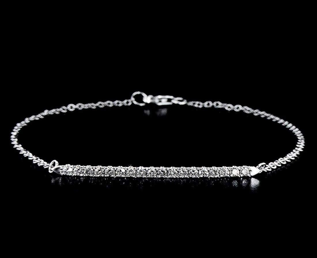 White Gold 0.4ctw Diamond Bracelet: One white gold bracelet, set with natural diamonds. Jewelry Weight: 1.87Grs Total Diamonds Weight: 0.4Cts Main Stones Description: Cut and shape: Round Brilliant Carats Weight: 0.4 Clarity: VS Color: 