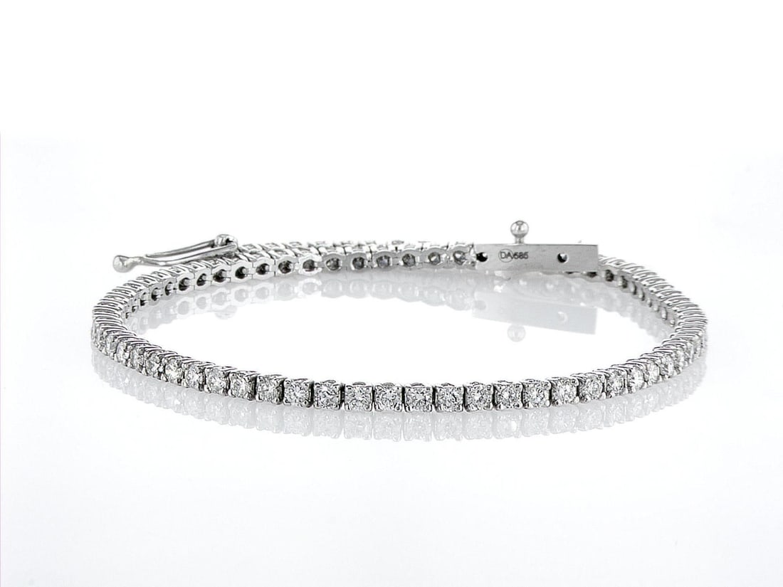 14kt White Gold 2.4ctw Diamond Tennis Bracelet: One 14k white gold bracelet "Tennis" (585 stamped), set with natural diamonds. Jewelry Weight: 6.03Grs Total Diamonds Weight: 2.4Cts Main Stones Description: Quantity: 80 Cut and shape: Round Brillian