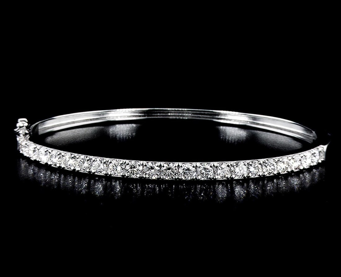 14kt White Gold 3.01ctw Diamond Bangled Bracelet: One 14k white gold bangle bracelet (585 stamped), set with lab grown diamonds. Jewelry Weight: 11.73Grs Total Diamonds Weight: 3.01Cts Main Stones Description: Cut and shape: Round Brilliant Carats We