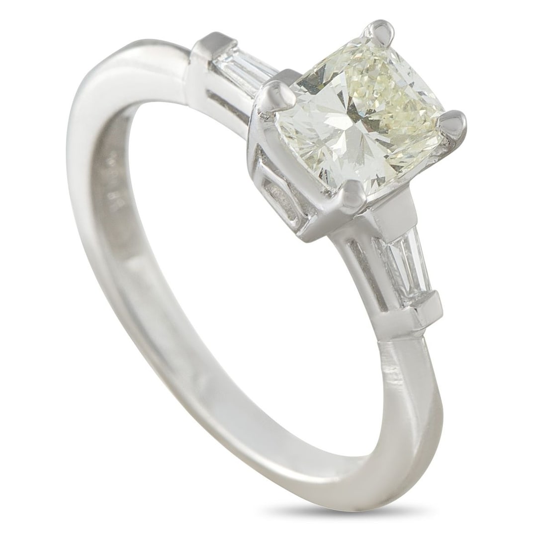 PLATINUM 1.12CT DIAMOND RING: At first glance, this ring appears like a classic solitaire. It carries a 1-carat center diamond raised prominently in a four-prong setting above a clean 2mm platinum band. The elevated 7mm top height