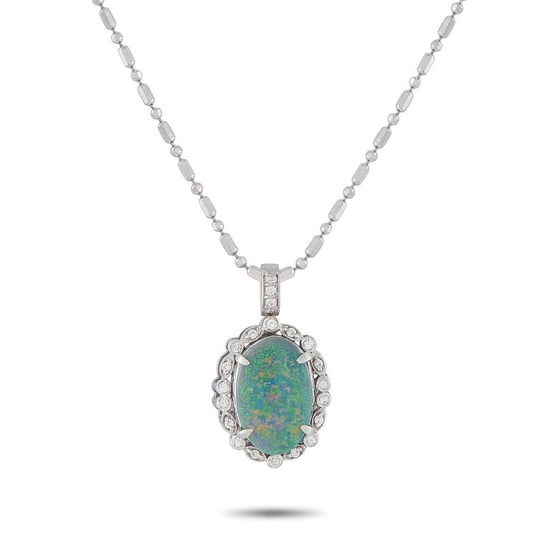 18K WHITE GOLD 0.20CT DIAMOND AND OPAL PENDANT NECKLACE: A 3.05 carat green Opal center stone adds color, texture, and dimension to this captivating necklace. Set in 18K White Gold, Diamonds totaling 0.20 carats surround the center stone for an added touch 