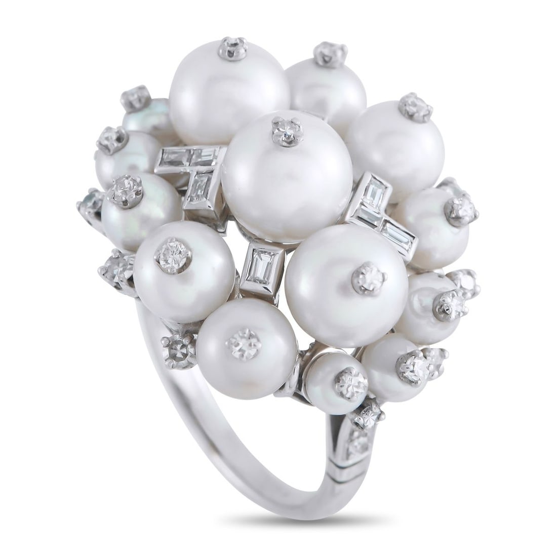 PLATINUM 0.75CT DIAMOND AND PEARL RING: Luminous Pearls and Diamonds with a total weight of 0.75 carats are beautifully juxtaposed at the top of this exquisite luxury ring. Set in Platinum, the unique design will instantly add a touch of dr
