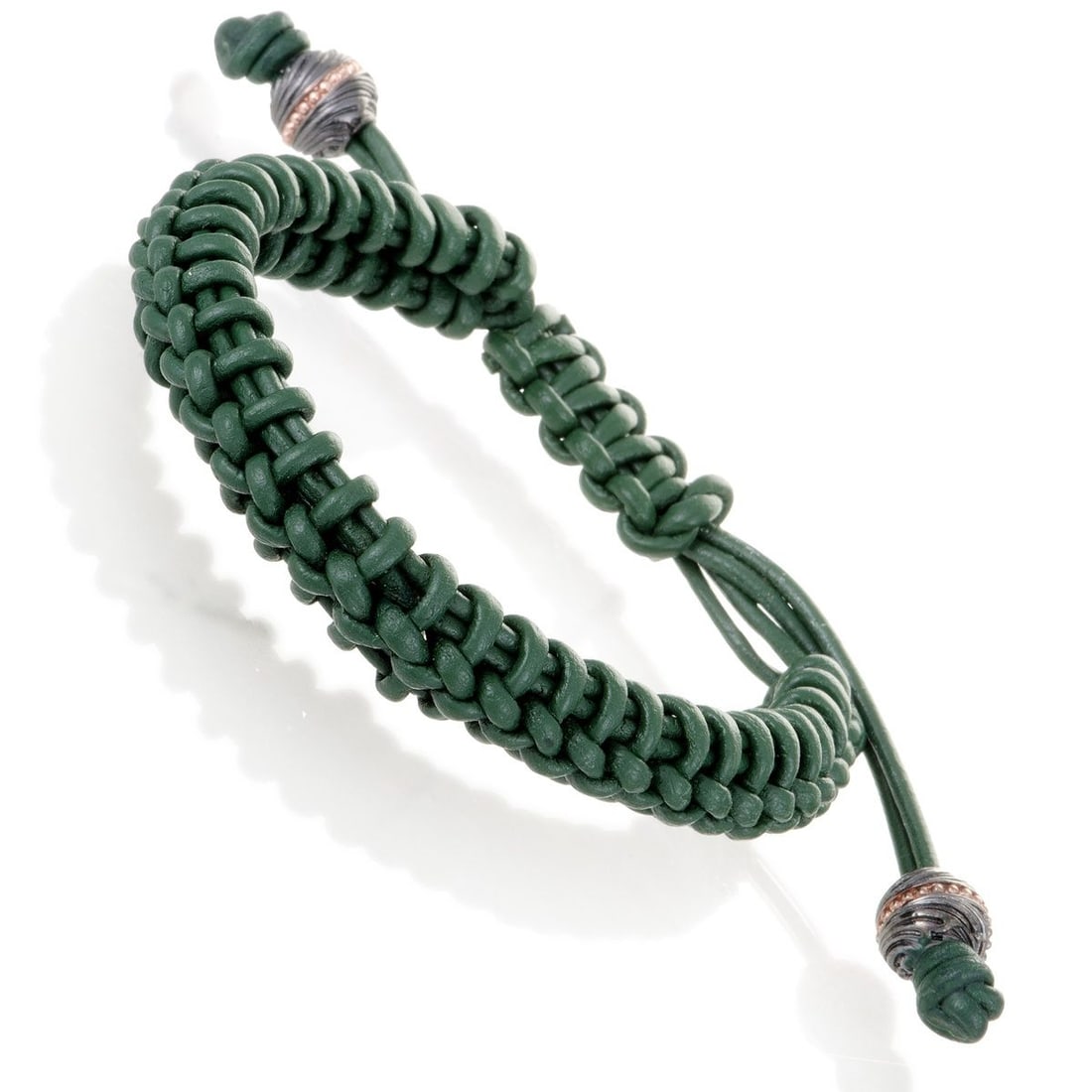 STEPHEN WEBSTER NO REGRETS UNISEX GREEN LEATHER AND GOLD TONE SILVER BRACELET: Designed in the brands authentic bold style and boasting vivacious color, this exceptional bracelet from Stephen Websters No Regrets collection is made of woven green leather with remarkably
