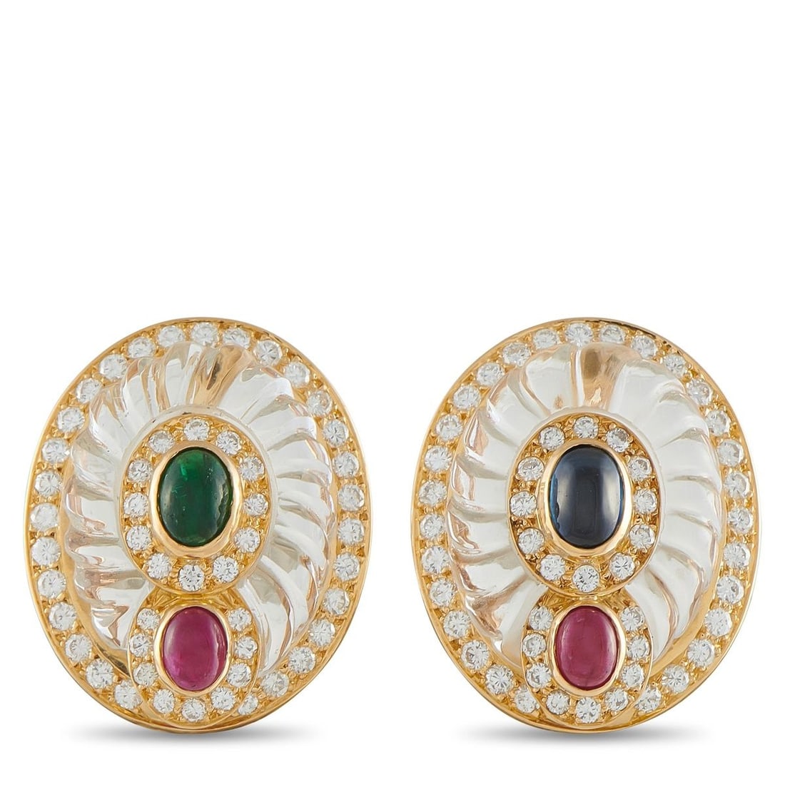 BOUCHERON 18K YELLOW GOLD DIAMOND, CRYSTAL, RUBY AND EMERALD OVAL CLIP-ON EARRINGS: A magnificent pair of estate Boucheron earrings masterfully crafted in 18-karat yellow gold. Each large oval earring presents an intricately fluted rock crystal body a hallmark of Boucheron's exceptio