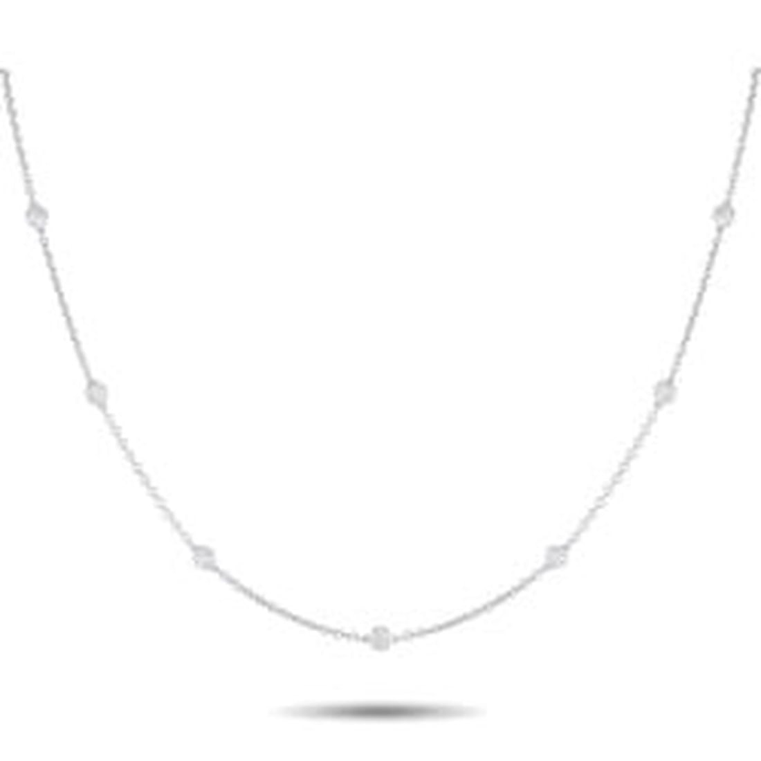 18K WHITE GOLD 0.75CT DIAMOND STATION NECKLACE: This sophisticated necklace will make a subtle statement. Set in 18K White Gold, the delicate chain is elevated by a series of bezel set Diamonds totaling 0.75 carats. Ideal for everyday wear, this im