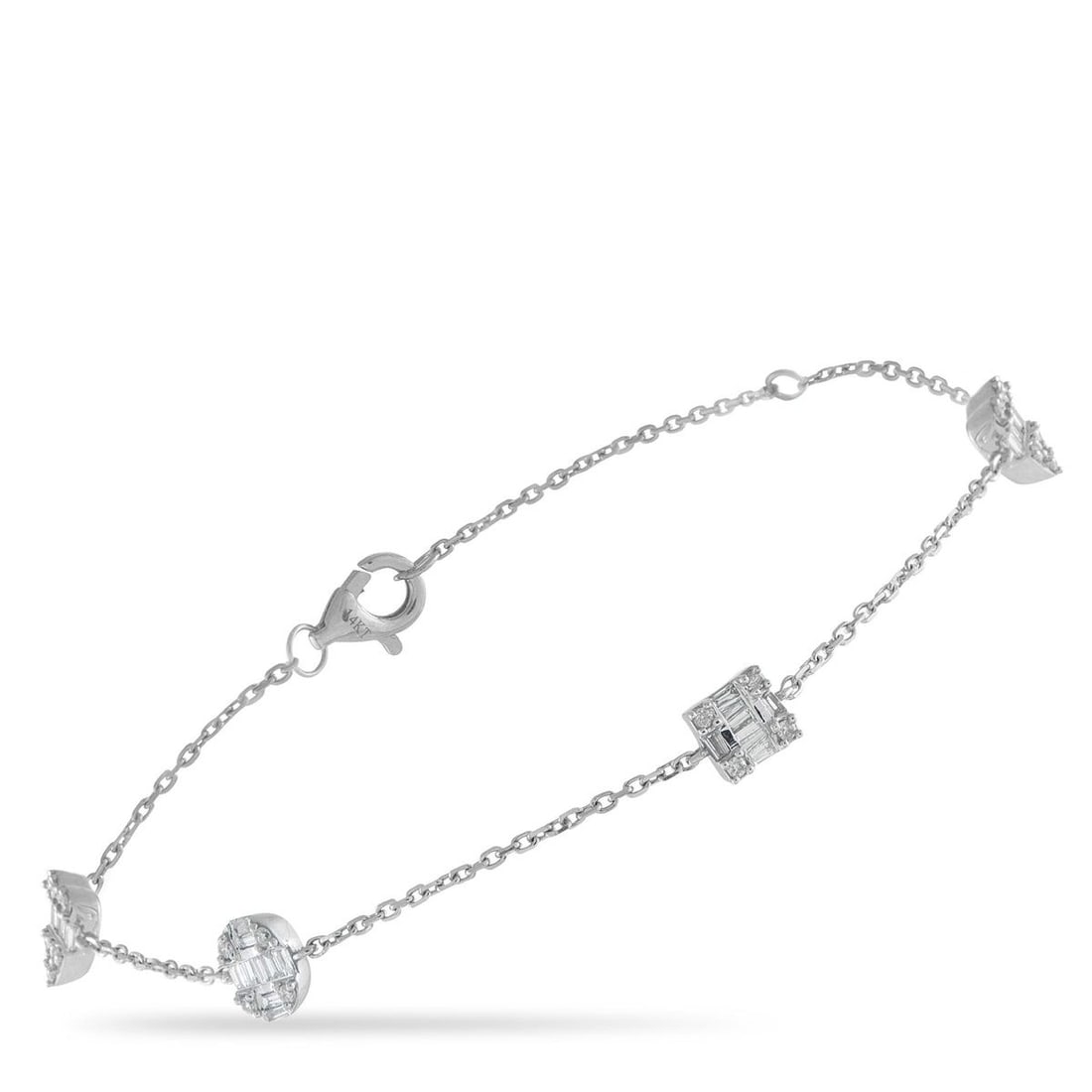 14K WHITE GOLD 0.40CT DIAMOND BRACELET: An exquisite array of Diamonds totaling 0.40 carats makes this delicate bracelet come alive every time it catches the light. Crafted from 14K White Gold, the understated design makes it easy to layer 
