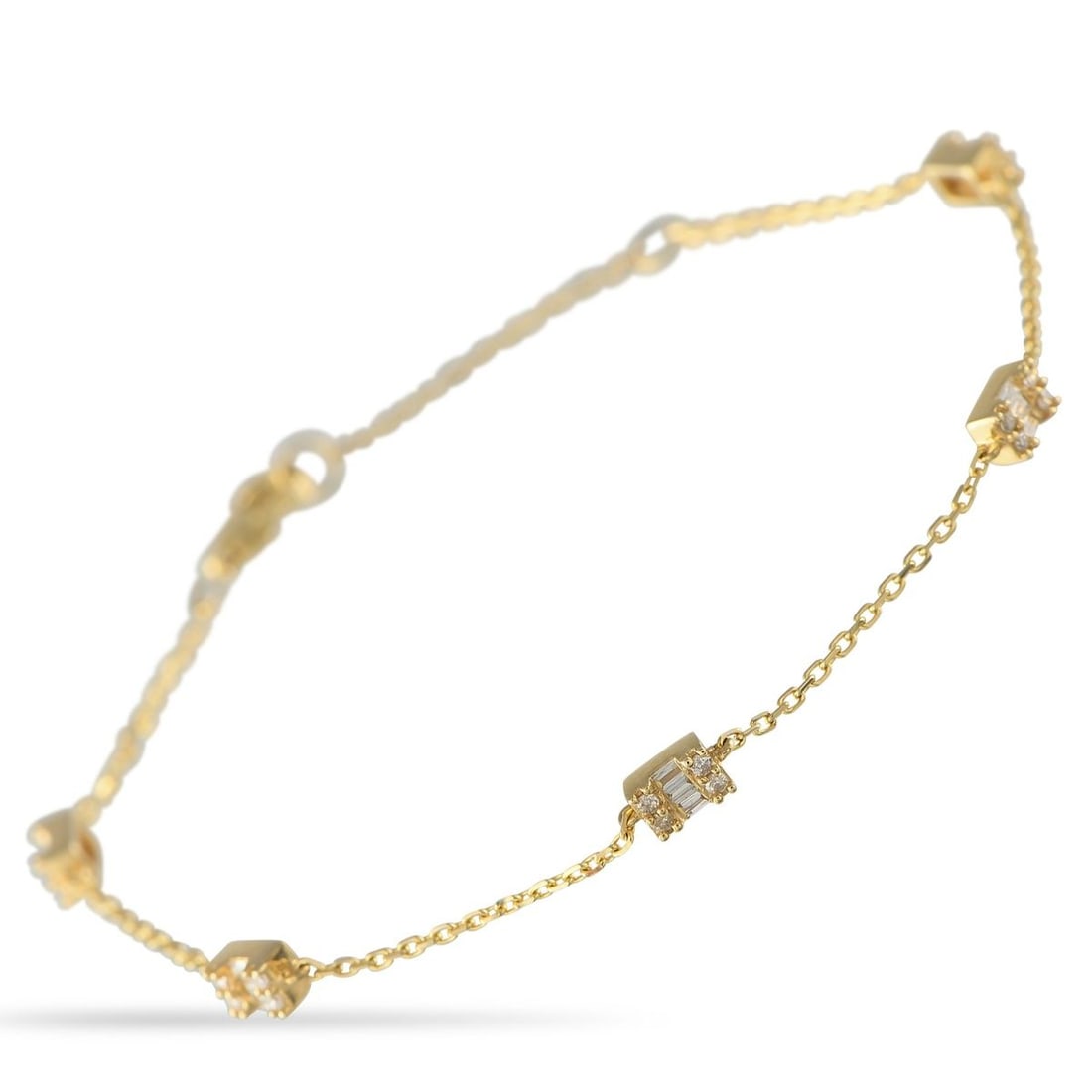 14K YELLOW GOLD 0.30CT DIAMOND STATION BRACELET: This sophisticated bracelet features a delicate design that will never go out of style. Diamonds with a total weight of 0.30 carats contrast beautifully against the 14K Yellow Gold setting. This piece