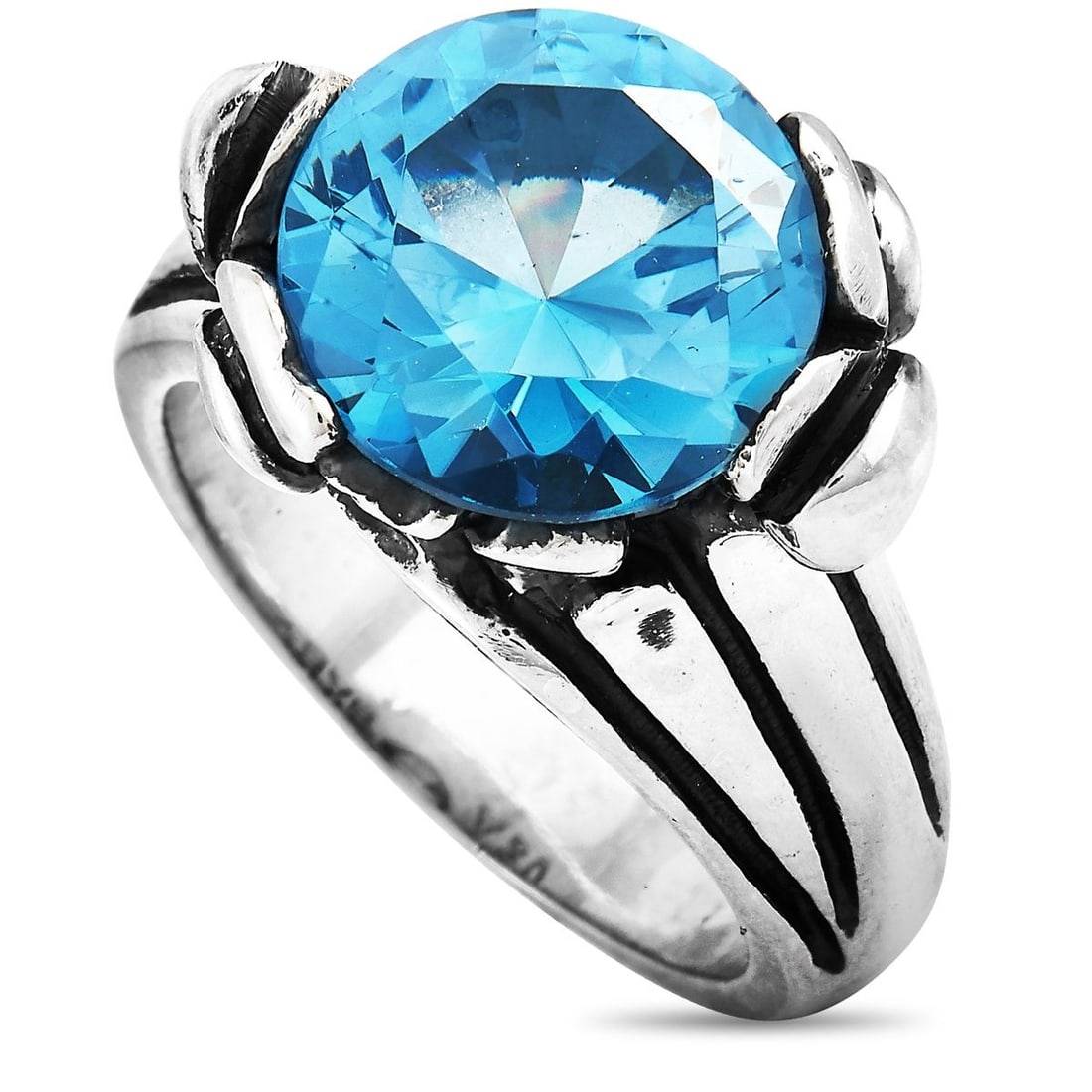 KING BABY SILVER AND BLUE TOPAZ FLORAL PATTERN RING: This King Baby ring is crafted from silver and set with a 13 mm blue topaz stone. The ring weighs 16.8 grams and boasts band thickness of 4 mm and top height of 10 mm, while top dimensions measure 19 