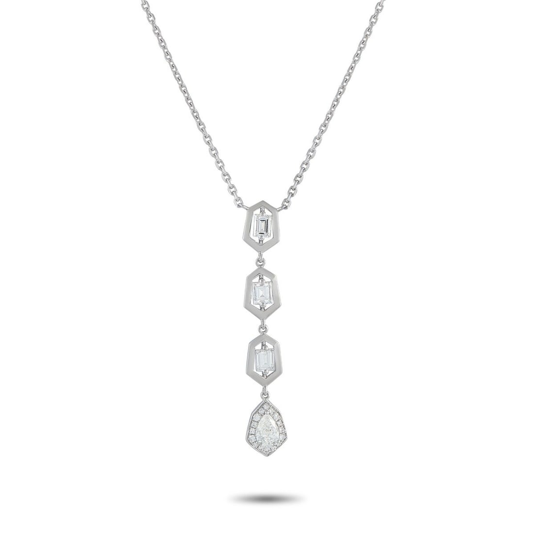 18K WHITE GOLD 1.25CT DIAMOND GEOMETRIC DROP NECKLACE: A modern drop necklace in 18K white gold, where geometry meets sparkle in a vertical flow. The pendant begins with three step-cut diamonds, each encased in a hexagonal frame. These stones guide the ey
