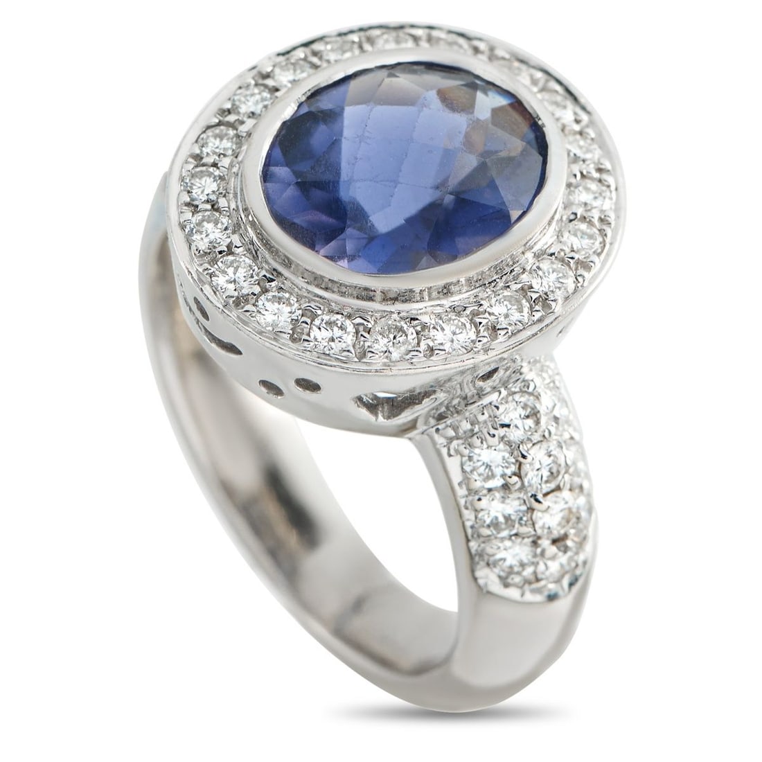 18K WHITE GOLD 0.80CT DIAMOND AND IOLITE RING: This dazzling ring is filled with exquisite details. Subtle star motifs elevate the sleek 18K White Gold setting and perfectly complement the midnight blue Iolite center stone. Diamonds with a total w